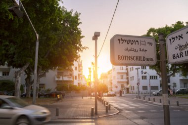 Tel Aviv-Yafo, Israel - June 9, 2018: Urban view from the famous Rothschild Boulevard in Tel Aviv. The Boulevard is a popular central meeting point for locals and visitors. clipart