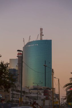 Tel Aviv, Israel - June 9, 2018: Rubinstein Building, a landmark skyscraper in Tel Aviv, Israel. The building was designed by Freiberger Architects, 1999. clipart