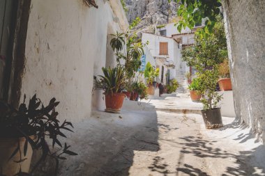 Architectural details from the narrow streets of Anafiotika, a traditional village in Athens, the Greek capital. Old neighborhood on the slopes of Acropolis, Greece. clipart