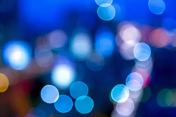 Urban lights bokeh image, defocused city lights background