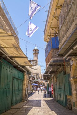 Jerusalem, Israel - June 15, 2018: Ancient streets and buildings in the old city of Jerusalem. Jerusalem is the holy land to the Abrahamic religions; Judaism, Christianity and Islam. clipart