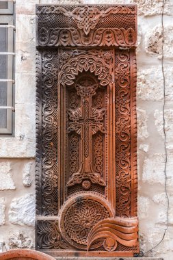 Traditional Armenian Khachkar, cross-stone art, sacred cross, carved rock found in Jerusalem, Israel. clipart