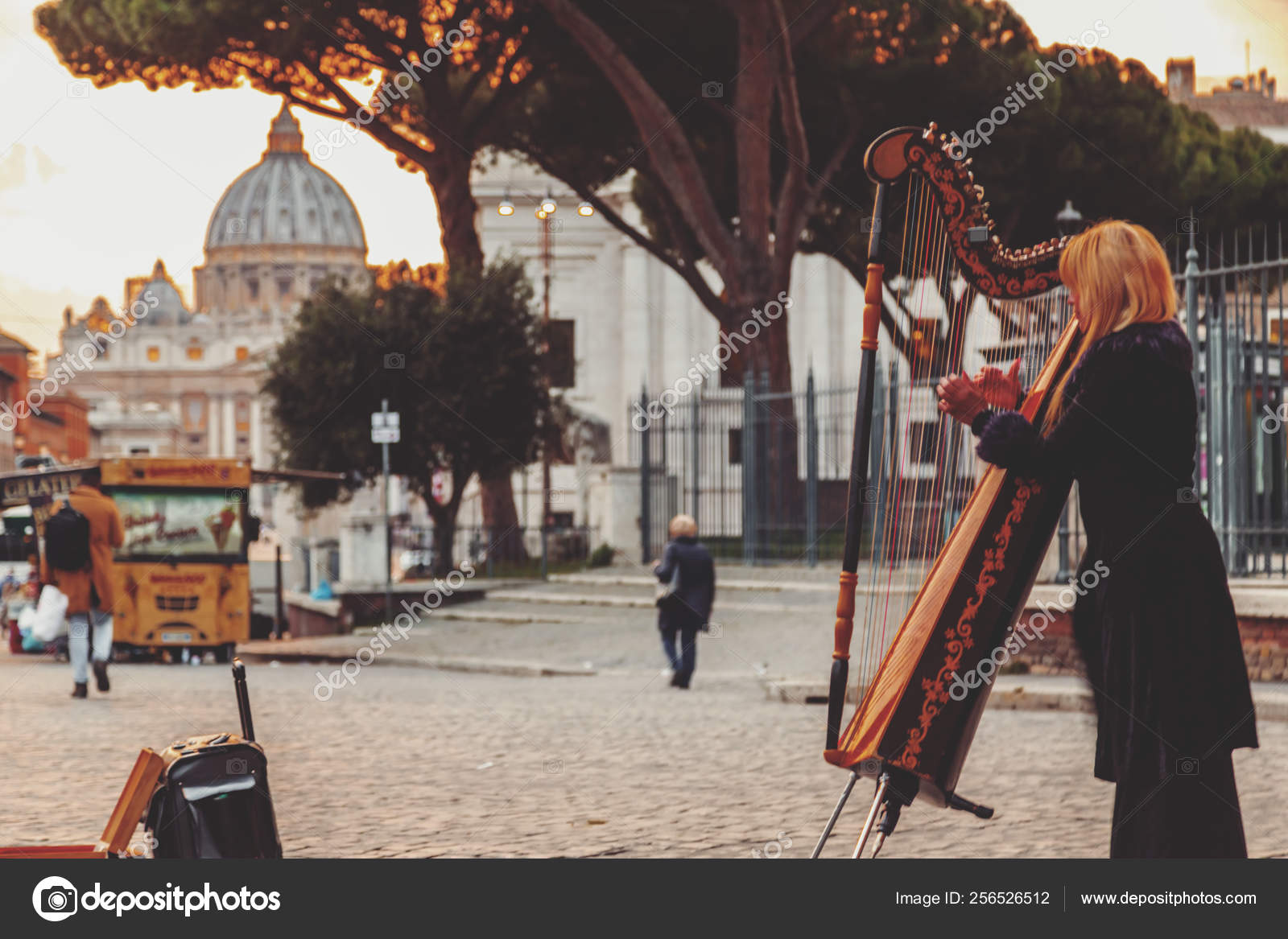 Street musician lady playing harp near Vatican, Rome, Italy Stock