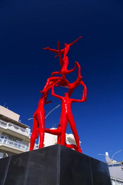 Modern sculpture with red human figures in Alexandroupoli, Greec — Stock Photo, Image