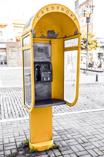 Yellow glass telephone booths with payphones are located on a pedestrian  street. Obsolete means of telephone communication in free access. Bialystok  Stock Photo - Alamy