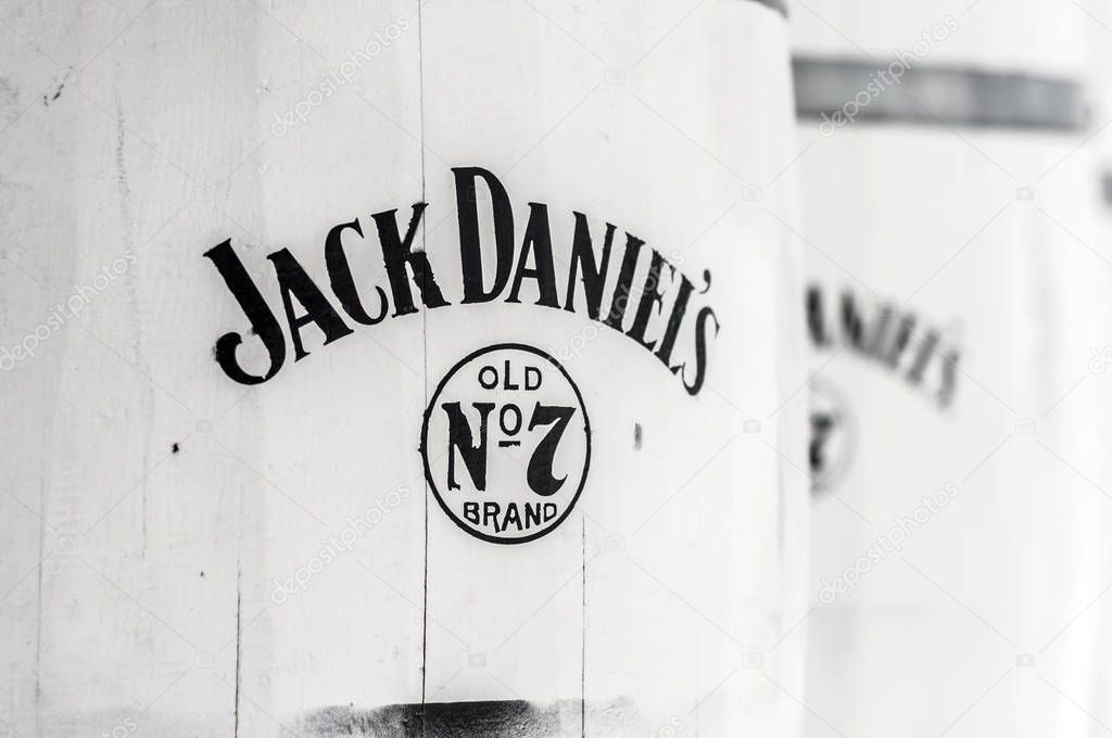 Cesme, Turkey - July 15, 2012: Logo of the famous whiskey brand Jack Daniel's on white barrels used as decorative objects at a bar in Cesme, Turkey.