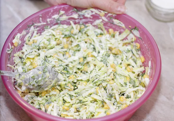 Fresh salad with canned corn, cabbage and parsley