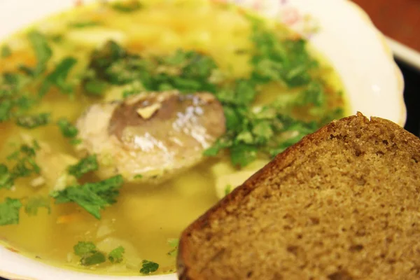 Tasty Fish Soup White Bowl Herbs Dark Bread Foreground — Stock Photo, Image