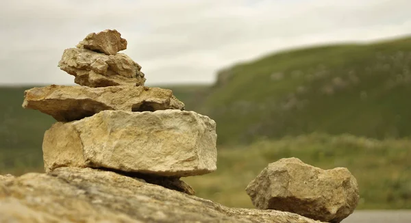 The Balanced stones on the big stone near caucasus mountains
