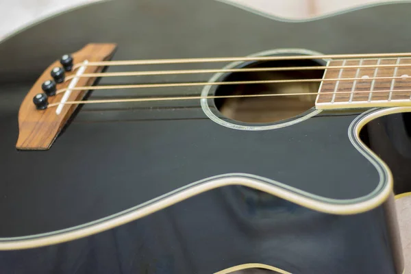 Acoustic bass guitar isolated on the white background — Stock Photo, Image