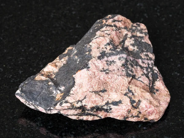 Macro Shooting Natural Mineral Raw Rhodonite Stone Black Granite Ural — Stock Photo, Image