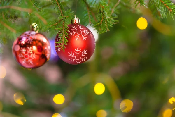 Xmas Background Two Red Balls Snowflake Pattern Christmas Tree Branch — Stock Photo, Image