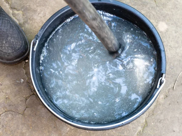 Stirring Chemicals Wooden Stick Bucket Outdoors Backyard — Stock Photo, Image