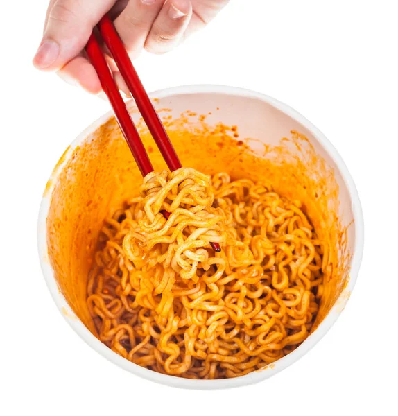 Hand Keeps Red Chopsticks Cooked Spicy Instant Noodles Isolated White — Stock Photo, Image