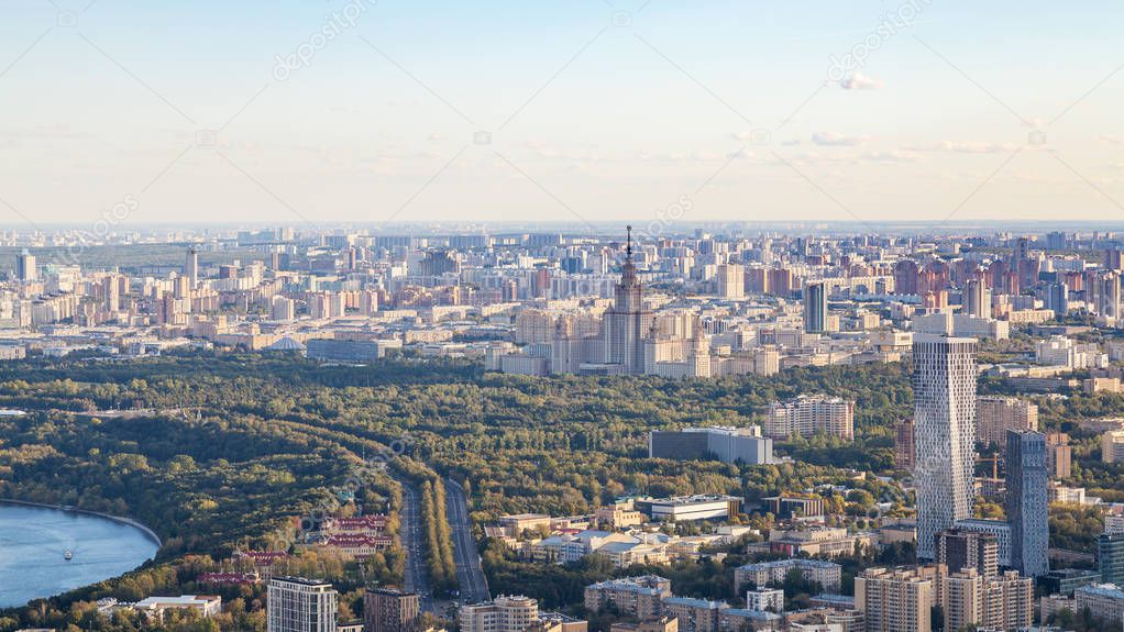 above view of southwest of Moscow with MSU University skyscraper in Sparrow Hills park from observation deck at the top of OKO tower in autumn sunset