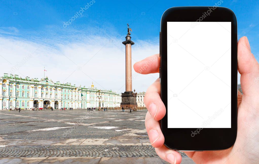 travel concept - tourist photographs of Palace Square in Saint Petersburg city in March on smartphone with empty cutout screen with blank place for advertising