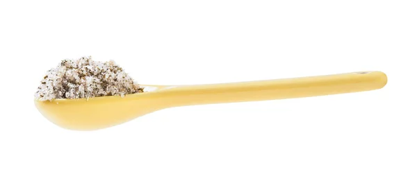Side view of ceramic spoon with seasoned salt — Stock Image Side view of ceramic spoon with seasoned salt Stock Image