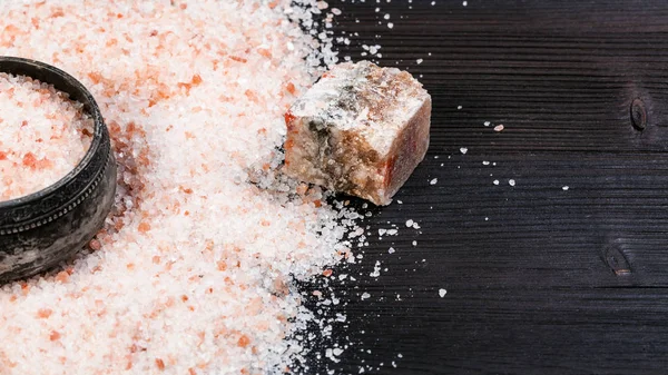 salt cellar and raw pink Himalayan Salt on table