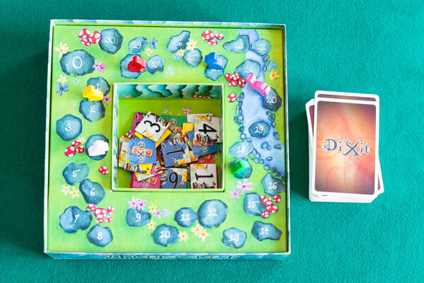 card deck, tiles and box of Dixit board game