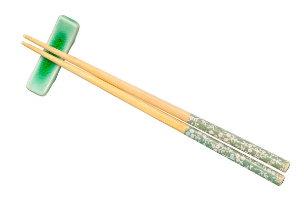 Bovenaanzicht van versierde stokjes op chopstick rest — Stockfoto