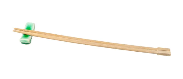 Side view of beech chopsticks served on rest — Stock Photo, Image