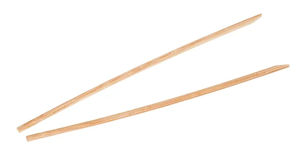 Jednorázové hnědé dřevěné hůlky izolované — Stock fotografie