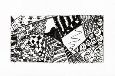 siyah mürekkeple çizilmiş soyut süs eli