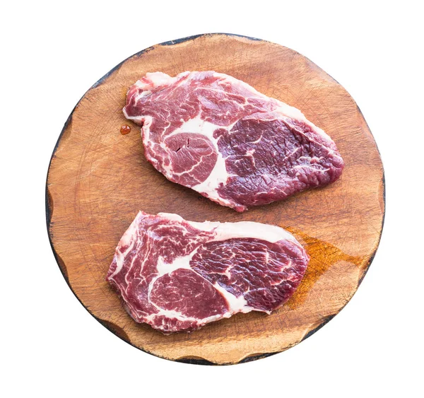 Two raw marble beef steaks on wooden cutting board — Stock Photo, Image