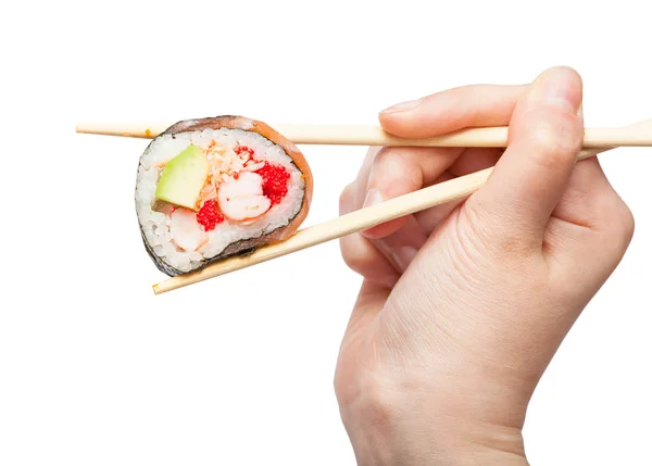 Bacchette tengono stile occidentale sushi roll da vicino — Foto Stock