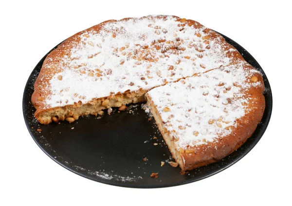 Pastel de nuez de pino italiano en rodajas en la placa cortada —  Fotos de Stock