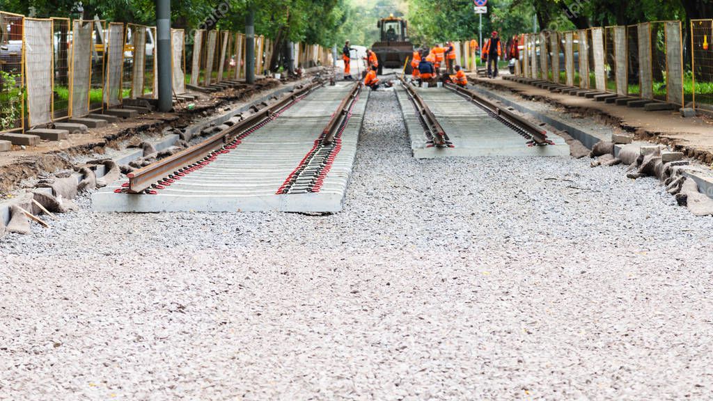 laying of rails of tramroad on concrete sleepers