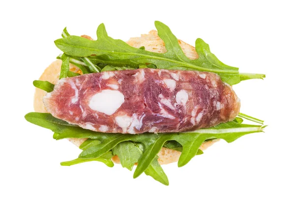 Panino con pane, salsiccia e rucola — Foto Stock