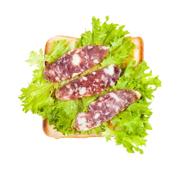 Öppen smörgås med rostat bröd, korv och bladsallad — Stockfoto