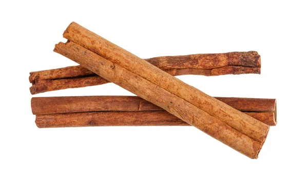 Three rolled dried Cinnamon sticks isolated — Stock Photo, Image