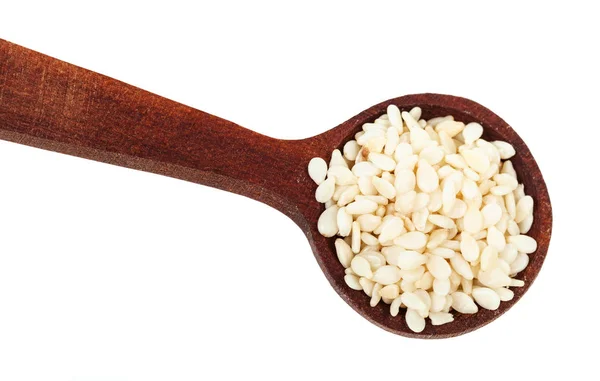 Top view of spoon with white sesame seeds close-up — Stock Photo, Image