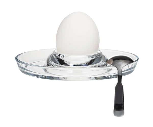 Boiled white egg and spoon in glass egg cup — Stock Photo, Image