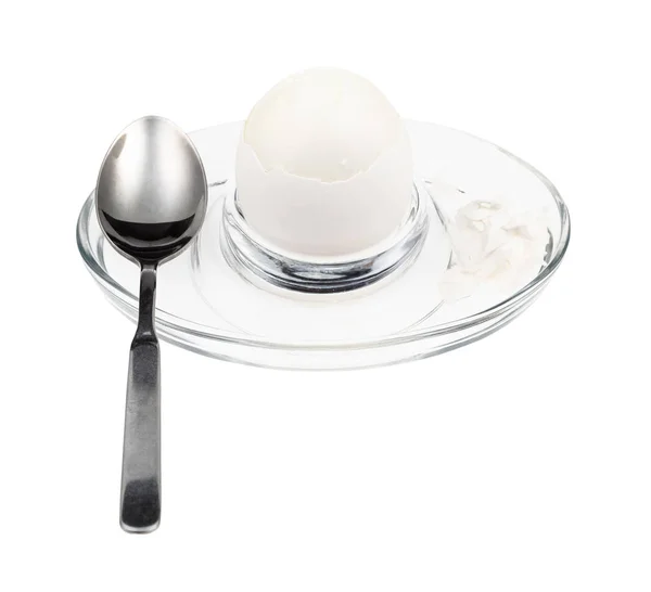 Peeled boiled white egg and spoon in glass egg cup — Stock Photo, Image