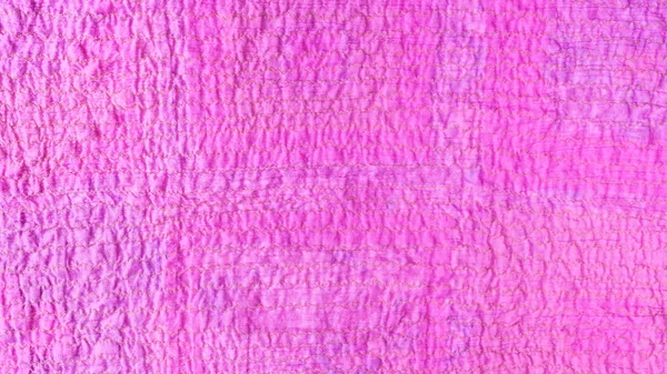 pink textured surface of scarf from crushed cotton