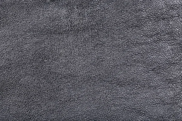 Texturerad bakgrund från svart läder — Stockfoto