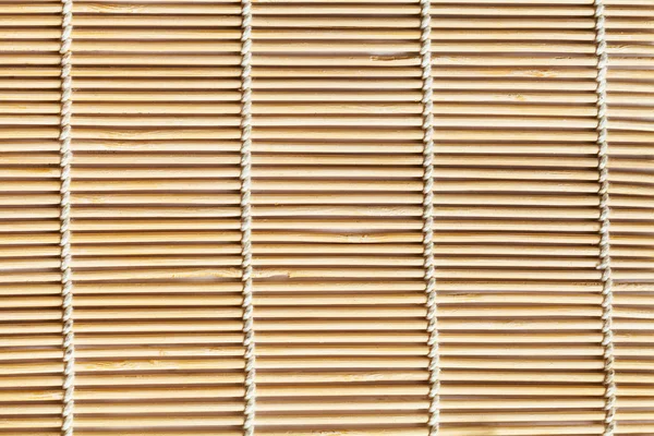 Textuur van houten mat gemaakt van lindestokken — Stockfoto