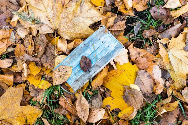 Dirty Used Sanitary Face Mask Wet Fallen Leaves Lawn City — Stock Photo, Image