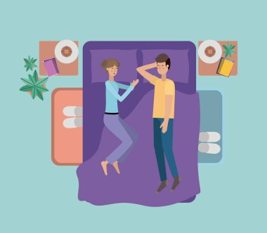 Genç çift yatak üzerinde rahatlatıcı