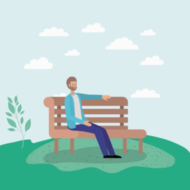 Park sandalyede oturan genç adam