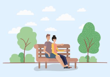 Park sandalyede oturan genç bir çift aşık