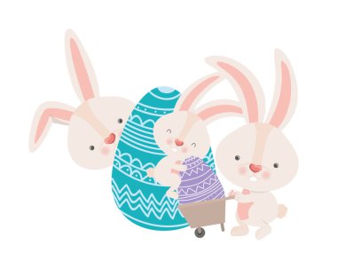 El arabası ve Paskalya yumurta simgesi olan tavşanlar