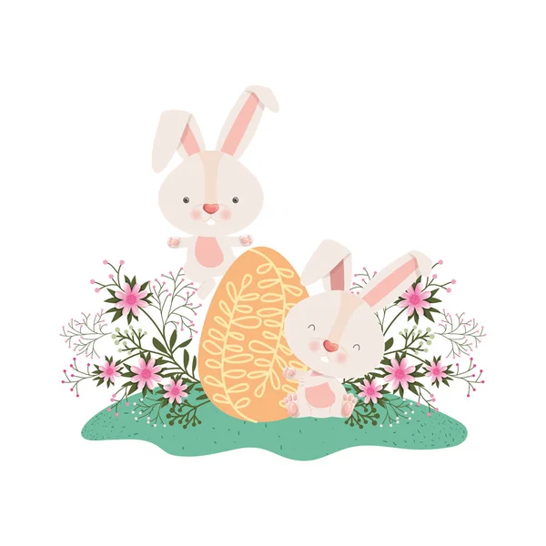 Conejos de Pascua con huevo y flores icono — Vector de stock