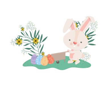 El arabası ve Paskalya yumurta simgesi olan tavşan