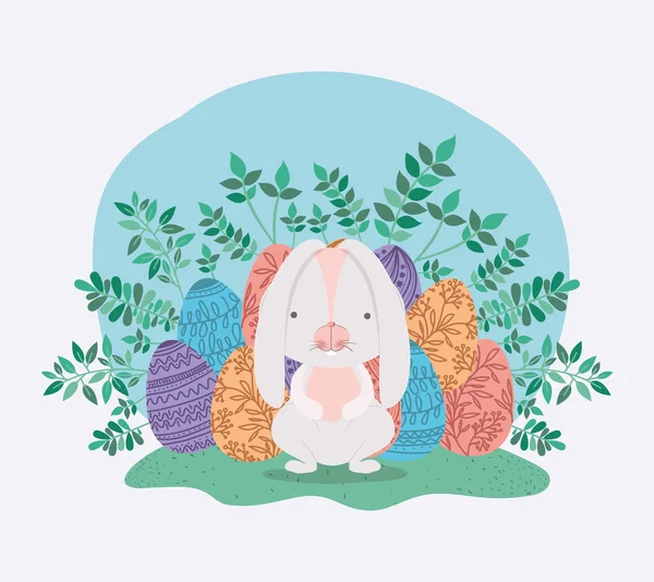 Schattig konijn met eieren geschilderd en bladeren in de tuin — Stockvector