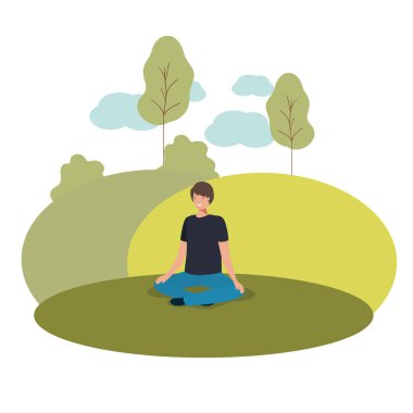 Parkta oturan genç adam.