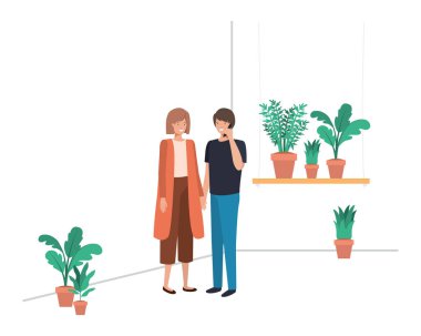 ev bitki ve akıllı telefon ile genç çift